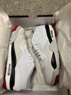 Jordan 4 RM White Sneakers with Black & Red Accents